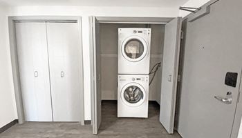 a white washer and dryer in a room